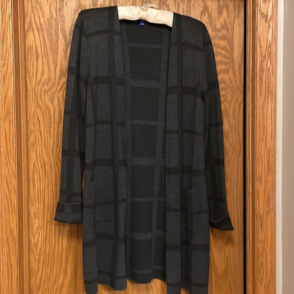 Knee-length patterned sweater size large.